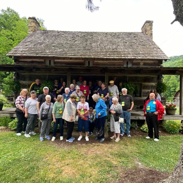 Motorcoach group at Hog Trial Cabin
